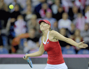 Russia’s Maria Sharapova returns the ball to Poland’s Agnieszka Radwanska during their Fed Cup World Group 1st round tennis match between Poland and Russia in Krakow, Poland on Sunday. Sharapova won 6-1, 7-5. AFP PHOTO