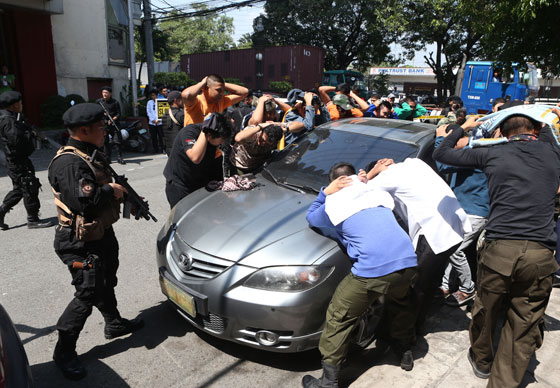 Members of the Manila police Special Weapons and Tactics “neutralize” a group of “hostage-takers” in a drill held Wednesday at the Emilio Aguinaldo College in Manila. PHOTO BY RENE DILAN