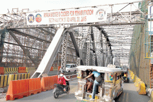 A BRIDGE TOO FAR Motorists as well as commuters in Manila will have to come up with a better plan on how to cross the Pasig River as the already jammed crossing will have one bridge less beginning today with the month-long total closure of the Ayala Bridge. The bridge, which was first built of wood in 1872 and was reconstructed in steel in 1908 to become the first steel bridge in the country, will undergo massive rehabilitation. 