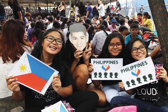  Fans of one direction, flash their fan paraphernalia as they jam the Mall of Asia in Pasay city hours before gates open for the two-night concert of the English-Irish boy band. A private plane with the band members on board - Minus Zayn Malik - arrived at the Ninoy Aquino International Airport at 2 p.m. saturday. Photo by Melyn Acosta 