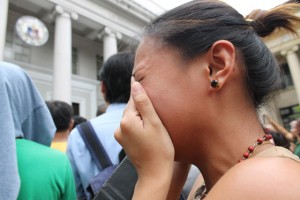 BLOOD, SWEAT AND TEARS  A bar candidate erupts in tears after reading the results of the 2014 Bar Examination posted outside the Supreme Court building in Manila.  PHOTO BY MELYN ACOSTA 