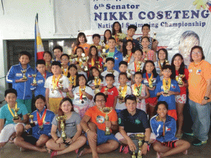 MOST OUTSTANDING SWIMMERS  Philippine Swimming League President Susan Papa and Secretary General Dra. Maria Susan Benasa pose with the Most Outstanding Swimmer awardees, champion coaches Ryan Robles and Rochelle Dimalanta in the  3rd Philippine Swimming League (PSL)-Diliman Preparatory School (DPS) national swimming championships at the DPS swimming pool in Quezon City.