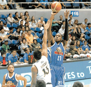 Purefoods import Denzel Bowles fires a shot against Barako Bull’s defense in the Philippine Basketball Association Season 40 Commissioners Cup at the Araneta Coliseum on Tuesday. PHOTO BY MIGUEL DE GUZMAN