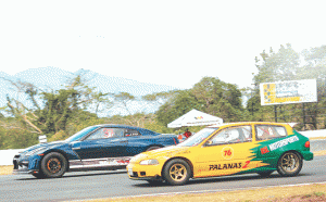 Drag racers try to out-sprint each other at the Batangas Racing Circuit