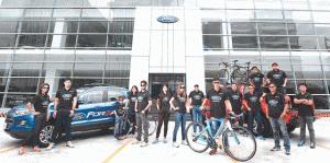 The Ford Forza Team pose with the Ford vehicles that will serve as their support vehicles