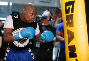 Floyd Mayweather Jr. hits the heavy bag during training. AFP file photo