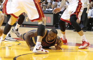 LeBron James No.23 of the Cleveland Cavaliers falls to the floor during a game against the Miami Heat at American Airlines Arena on Monday in Miami, Florida. AFP PHOTO