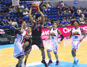 THE BEAST Calvin Abueva of Alaska tries to score a layup against James Yap of Purefoods during their quarterfinal match on Sunday in the Philippine Basketball Association Commissioner’s Cup at the Araneta Coliseum. CONTRIBUTED PHOTO