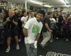 Manny Pacquiao smiles at fans during a training session. AFP FILE PHOTO