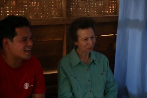 The princess smiles as she listens to one of the beneficiaries of Save the Children through a translator beside her