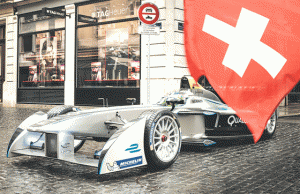 A Formula E racecar driven by Swiss driver Simona de Silvestro runs through the city streets of Geneva