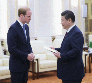 Britain’s Prince William (L) meets Chinese President Xi Jinping (R) at the Great Hall of the People in Beijing on Monday. The Duke of Cambridge is in China on a four-day visit, the highest-profile visit by a member of the royal family for 30 years. AFP PHOTO