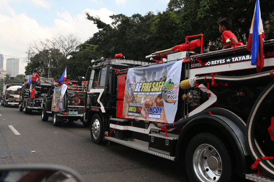 Fire volunteers from the United Firemen Association of the Philippines join a fire prevention caravan on Sunday, the first day of Fire Prevention Month. PHOTO BY RENE H. DILAN