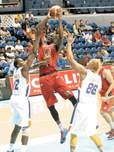 Barako Bull’s Solomon Alabi drives past the defense of NLEX during their game for the 2015 PBA Commissioner's Cup at the Smart Araneta Coliseum in Quezon City on Tuesday. PHOTO BY MIGUEL DE GUZMAN