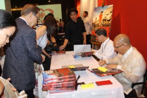 GIVING THE CARITAS  WAY Luis Antonio Cardinal Tagle (seated 2nd from right) and Dr. Isagani Cruz, president of The Manila Times College, sign copies of the book “Love for the Poor: The Story of Caritas Manila” on Wednesday at Ayala Museum in Makati City. Tagle, during the book launch, called on Filipinos to give love to make the Philippines a better place to live in. PHOTO BY MELYN ACOSTA 