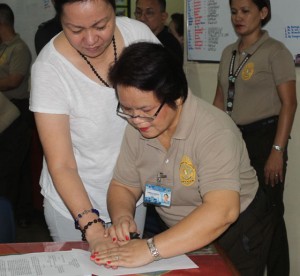 JANET COME LATELY An official of the Correctional Institute for Women books convicted felon Janet Lim Napoles. CONTRIBUTED PHOTO 