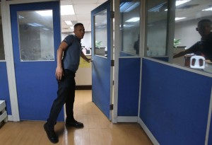 Shut to the top  A staffer closes the door leading to the Chairman’s office where the poll body’s commissioners were holding a meeting. Photo by Rene Dilan