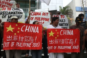 MESSAGE SENT Protesters holding a picket-rally at the Chinese Embassy in Makati City on Friday want China out of the South China Sea (West Philippine Sea), citing Beijing’s reclamation activities in various Philippine reefs there. They may have found support from G7 foreign ministers who late this week told China not to  “change the status quo and increase tensions” in the region’s vital waterway. PHOTO BY RENE H. DILAN 