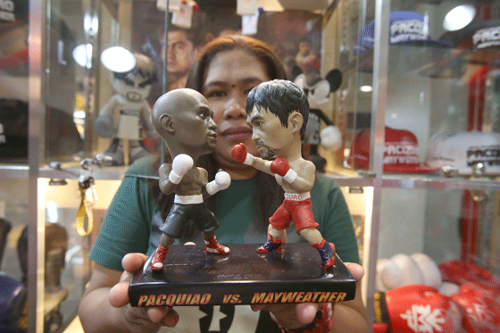 You know the big fight is near when dolls, such as these miniatures, start appearing in Manila shops. Philippine champ Manny Pacquiao will face unbeaten American Floyd Mayweather on May 3, 2015 in what has been billed as the fight of the century. PHOTO BY RENE DILAN