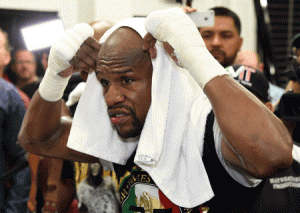 Floyd Mayweather Jr. puts a towel over his head as he works out at the Mayweather Boxing Club in Las Vegas, Nevada. AFP PHOTO