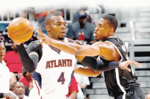 Thaddeus Young No.30 of the Brooklyn Nets defends against Paul Millsap No.4 of the Atlanta Hawks during Game Two of the Eastern Conference Quarterfinals of the NBA Playoffs at Philips Arena in Atlanta, Georgia.  AFP PHOTO