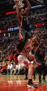John Henson No.31 of the Milwaukee Bucks lands on Pau Gasol No.16 of the Chicago Bulls for a foul during the first round of the 2015 NBA Playoffs at the United Center in Chicago, Illinois. AFP PHOTO