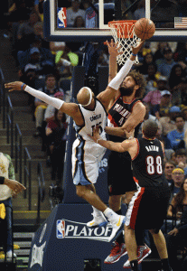 Robin Lopez No.42 of the Portland Trailblazers tries to block a shot by Vince Carter No.15 of the Memphis Grizzlies during the second half of Game 5 of the first round of the 2015 NBA Playoffs at FedExForum in Memphis, Tennessee. AFP PHOTO