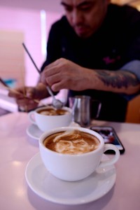 Graphic artist and barista Zach Yonzon uses coffee latte milk froth to illustrate depictions of boxing icon Manny Pacquiao (bottom) and American boxer Floyd Mayweather Jr. at his cafe in Manila. AFP PHOTO 