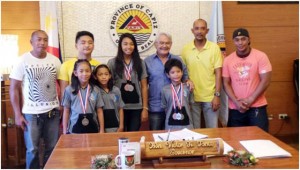 CHOSEN FEW Capiz Turbo Sharks coaches and swimmers who competed in the 16th Royal Bangkok Swimming Competition in Thailand during courtesy call with Capiz Governor Victor Tanco. CONTRIBUTED PHOTO