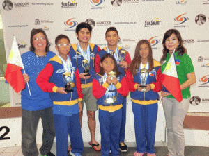 OUTSTANDING SWIMMERS  Most Outstanding Swimmer awardees Sean Terence Zamora, Kyla Soguilon, Micaela Jasmine Mojdeh, Stephen Guzman and Martin Jacob Pupos display their trophies with Philippine Swimming League President Susan Papa and Secretary General Maria Susan Benasa.