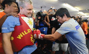 Manny Pacquiao spars with his coach Freddie Roach during a training session at the Wild Card Boxing Club in Hollywood, California on Thursday. AFP PHOTO