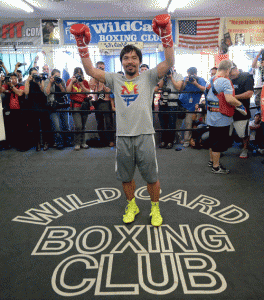 Manny Pacquiao waves at the fans during training at the Wild Card gym in California.