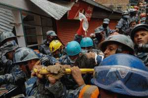 MIRACLE IN NEPAL Nepalese rescuers carry Pemba Lama, 15, on a stretcher in Kathmandu on April 30, 2015 after he was pulled out of the rubble five days after he was buried by an earthquake. The teenager’s rescue from the ruins of a collapsed building in Kathmandu provided a rare moment of joy as relief coordinators warned it could take five days to reach some of the worst hit areas, accessible only by foot. AFP PHOTO