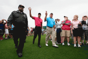 Tiger Woods and Mark O’Meara wave to patrons during a practice round prior to the start of the 2015 aMasters Tournament at Augusta National Golf Club on Wednesday in Augusta, Georgia. AFP PHOTO