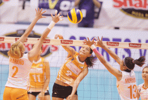 PLDT’s Alyssa Valdez unleashes a powerful hit against Meralco’s Aby Marano No. 2 and Maica Morada No.13 during the elimination round of the Shakey’s V-League Open Conference at The Arena in San Juan City. CONTRIBUTED PHOTO