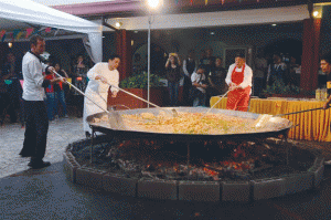 A giant paella valenciana complete with chorizo, chicken, and seafood, and cooked the traditional way over charcoal and firewood, will be the centerpiece of the festival