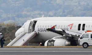 An Asiana Airlines Airbus A320 aircraft is seen with its evacuation slides deployed after it overran a runway at the Hiroshima airport in Mihara in Hirishima prefecture, western Japan on Wednesday. More than 20 passengers were injured when an Asiana Airlines Airbus A320 overran a runway at the Hiroshima airport on April 14. The South Korean carrier’s Flight OZ162, which took off at Incheon airport, was attempting to land in Hiroshima when the incident occurred. AFP PHOTO