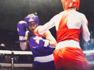 Nesthy Petecio (blue) preparing to launch a shot against Japanese Shimoto Aya during their semifinal match on Saturday in the 22nd President’s Cup in Palembang, Indonesia. CONTRIBUTED PHOTO