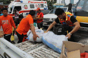 Members of the Metropolitan Manila Development Authority Rescue Team load provisions on a truck as they prepare to move out of their base and proceed to northern Luzon where tropical storm Chedeng is expected to hit land. PHOTO BY MELYN ACOSTA