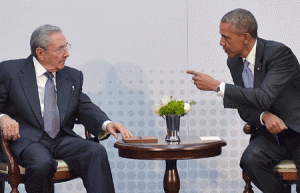 US President Barack Obama (R) speaks with Cuba’s President Raul Castro (L) on the sidelines of the Summit of the Americas at the ATLAPA Convention Center on April 11, 2015 in Panama City. AFP PHOTO