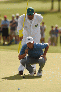 ON TARGET Jordan Spieth of the US and caddie, Michael Greller, line a putt during Round 3 of the 79th Masters Golf Tournament at Augusta National Golf Club in Augusta, Georgia. AFP PHOTO