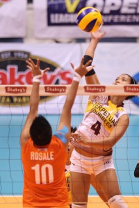 TOP SPIN  Perpetual top hitter Jamel Suyat (4) goes for a top spin against Mary Rosale of Coast Guard during their Shakey’s V-League Open Conference clash at The Arena in San Juan. The Lady Altas won, 25-16, 19-25, 25-22, 26-28, 15-11. CONTRIBUTED PHOTO