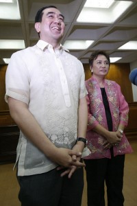 NEW KIDS ON THE BLOCK  Incoming Comelec Chairman Andres Bautista (right) and Commissioner Rowena Guanzon beam as they enter the session hall of the Commission on Elections where they faced the media after their appointment. PHOTO BY MIGUEL DE GUZMAN 