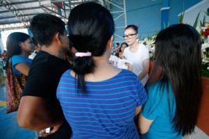 BRAVE FRONT Barbara Ang, daughter of one of the owners of Kentex Manufacturing (center), faces the family and kin of the victims of the factory fire in a dialogue on Friday. Photo by Miguel de Guzman