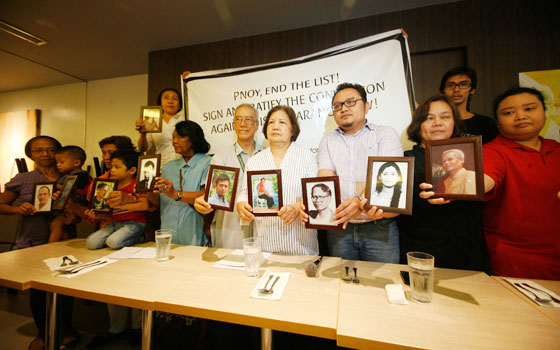 Families of  desaparecidos or people believed to be abducted or secretly imprisoned show pictures of their missing loved ones in a forum in Quezon City on Thursday as they mark the international Week of the disappeared. Photo By Miguel De Guzman 