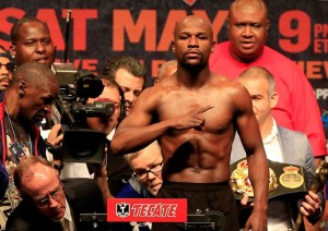  Floyd Mayweather Jr.  at their official weigh-in on Sunday (Saturday in Manila) at the MGM Grand Garden Arena in Las Vegas