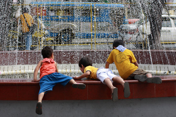 Boys make the most of their summer as they play at a fountain in Marikina City (Metro Manila) on Sunday, a week before the opening of a new school year. PHOTO BY MIGUEL DE GUZMAN