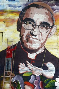 POOR MAN’S CHAMP A man cleans a mural of Monsignor Oscar Romero in Panchimalco, 20 km south of San Salvador ahead of the slain cleric’s beatification on Saturday.   AFP PHOTO 