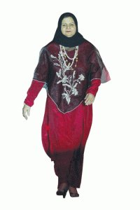 Madame Fehmina Mona Safdar of Pakistan advocates Muslim fashion with a long-sleeved red dress with a piña cover-up dotted with floral embroidery