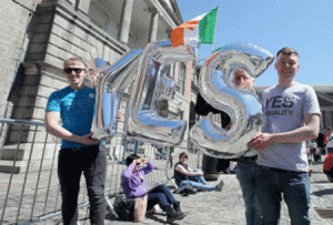 Supporters for same-sex marriage hold an inflatable Yes sign as they wait for the announcement on the referendum in Dublin castle on May 23, 2015. Ireland appeared to have voted to allow gay marriage today in a historic referendum which would see the historically Catholic country become the world's first to make the change after a popular vote. AFP PHOTO